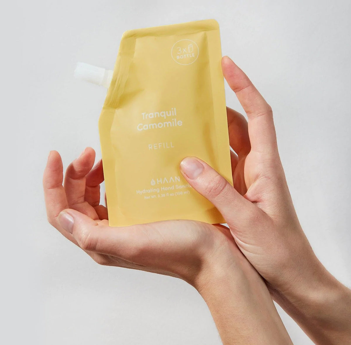 HAAN Citrus Noon drėkinantis rankų dezinfekcinis skystis 100ml